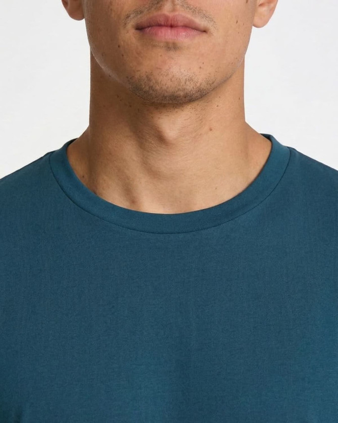 A men's/unisex t-shirt in a deep teal colour featuring a round neckline and a simple design.