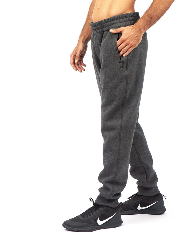 Men's track pants in brushed fleece, featuring a drawstring waist and side pockets, in a dark grey colour.