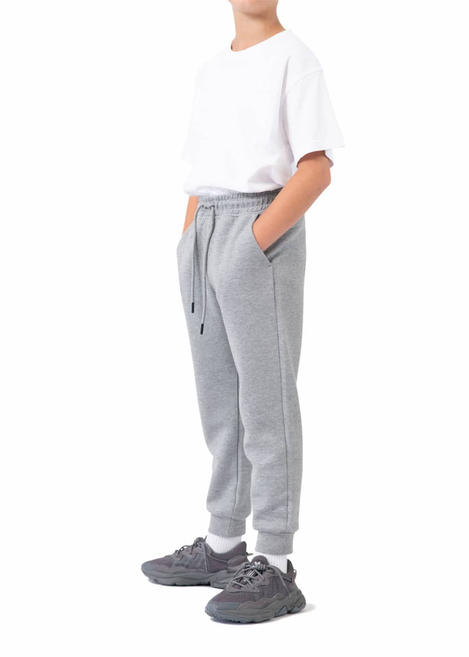 Grey three-layer cotton track pants with an elastic waistband, featuring side pockets and a casual fit.