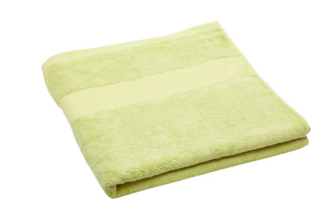 A folded bath towel in soft green featuring a striped design. It has a simple logo on one side.