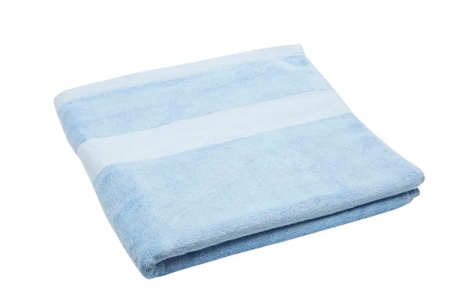 A folded bath towel in light blue with a white striped section and a textured finish.