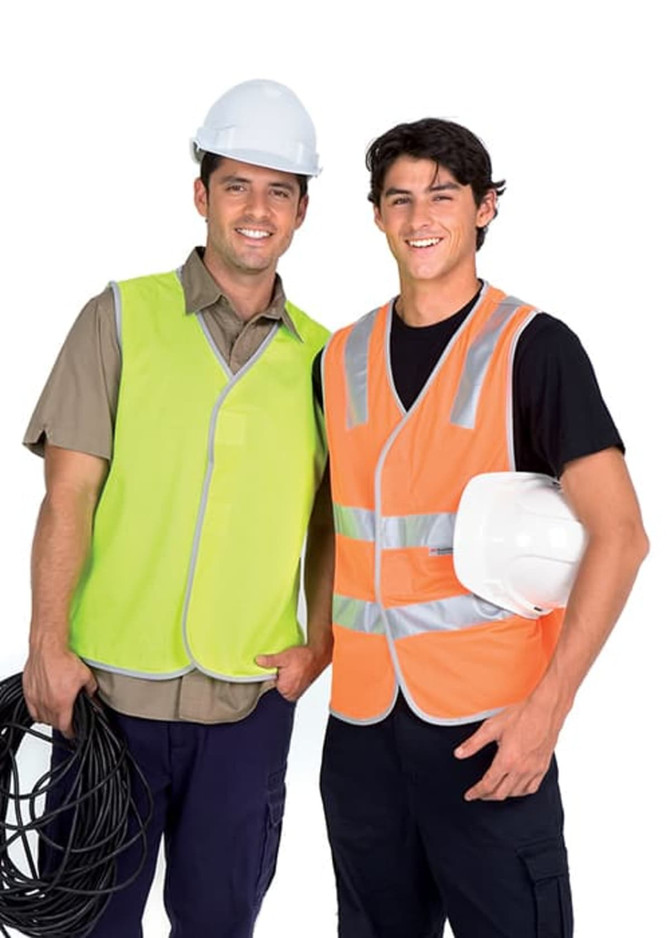 Two men wearing 100% polyester work vests in lime green and orange, holding tools and wearing safety helmets.