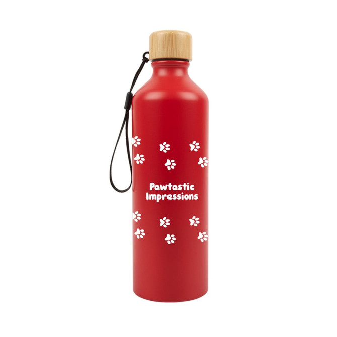 A drink bottle in red with a bamboo lid and a logo, featuring a paw print design.