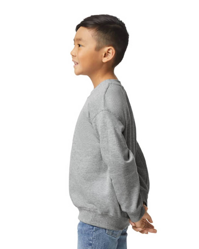 A grey youth sweatshirt is displayed, featuring long sleeves and a ribbed neckline. The model is positioned sideways.