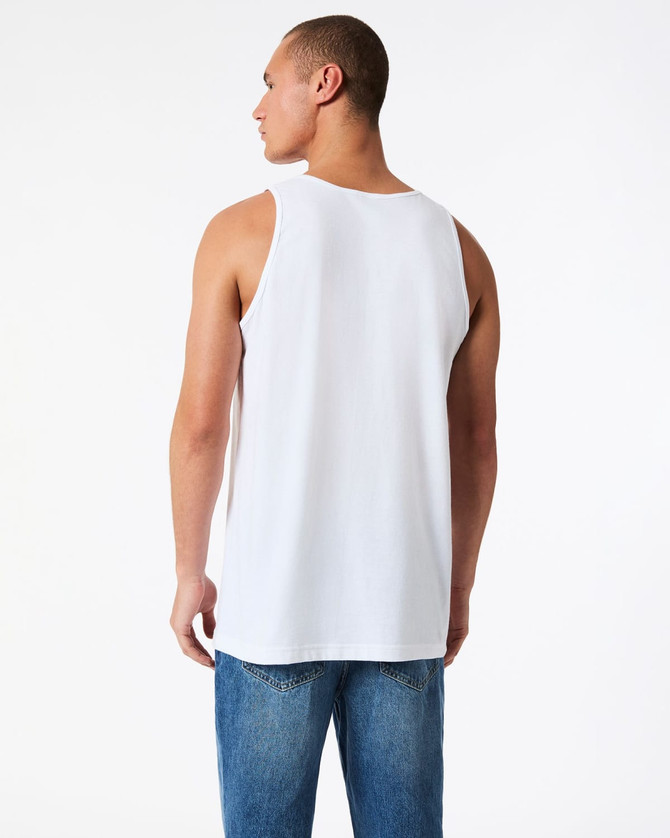 A back view of a white unisex fine jersey tank top, paired with blue denim jeans. It features a branding logo.