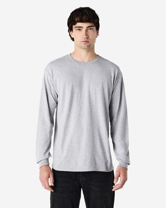 A long sleeve t-shirt in heather grey featuring a crew neckline and fitted sleeves, displayed on a model.
