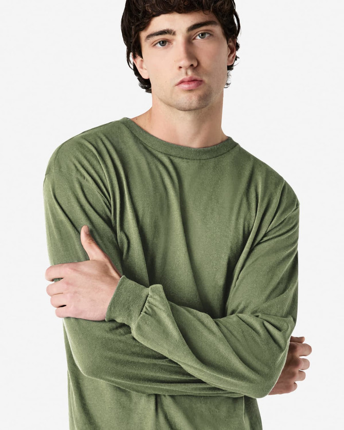 A long sleeve t-shirt in olive green, featuring a simple design and a logo on the front.