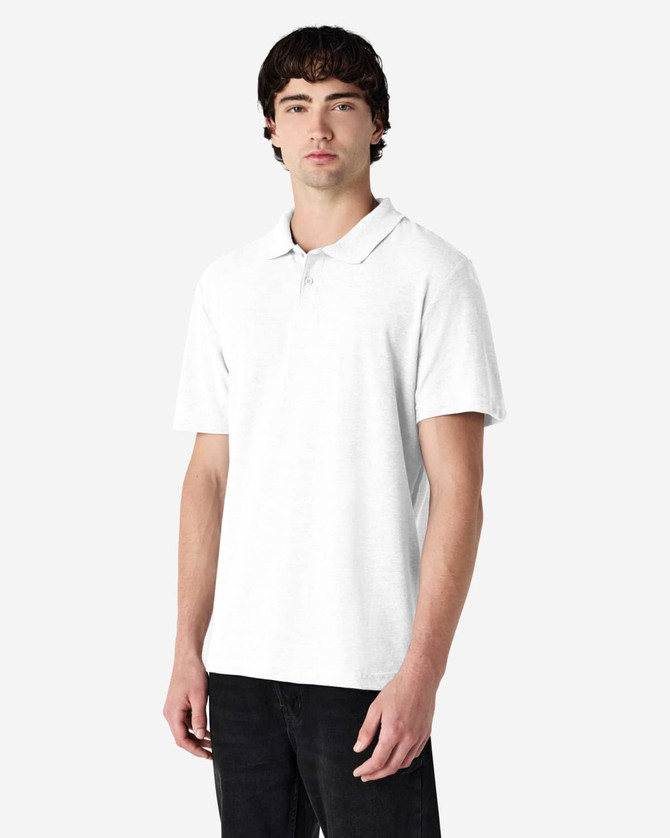 A model wearing a plain white double pique polo shirt, featuring a subtle logo on the chest.