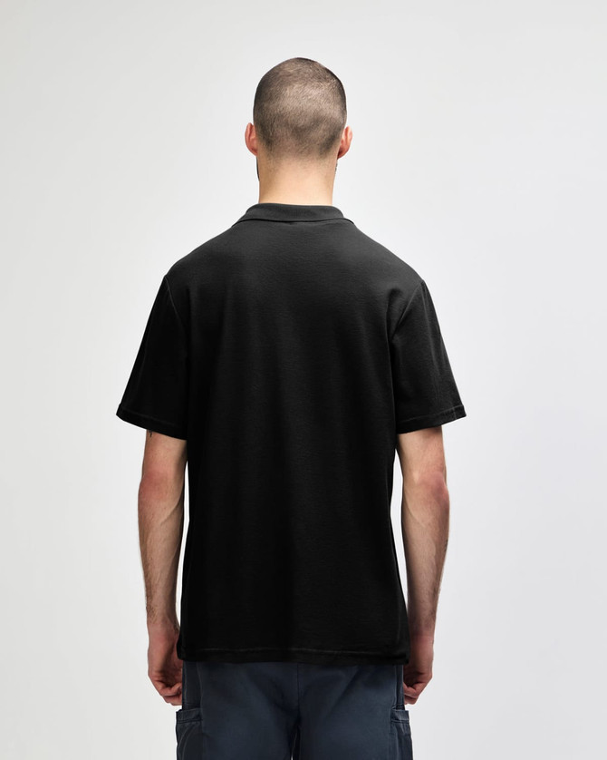 A black adult polo shirt with a double pique design, featuring short sleeves and a collar. There is a logo on the shirt.