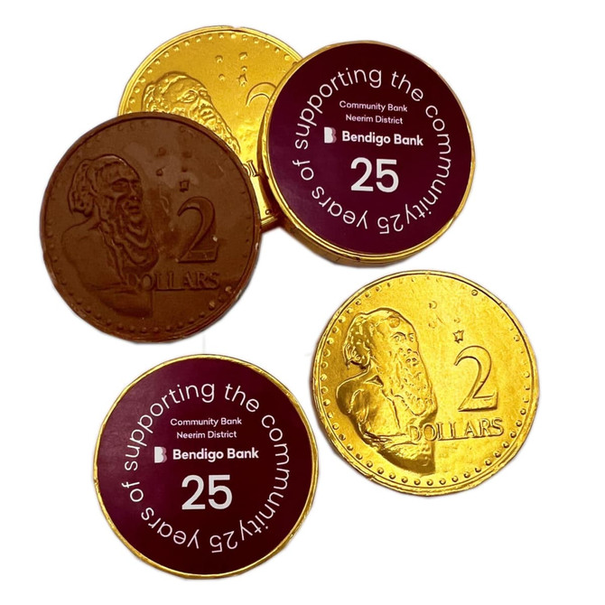 Chocolate coins in gold and brown, featuring monetary designs and a logo.