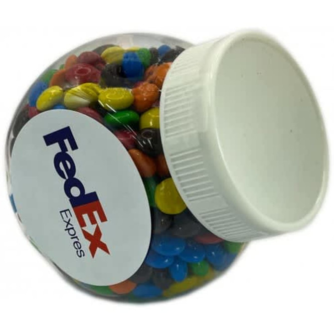 A clear plastic jar filled with colourful M&Ms, featuring a white lid and a logo on the side.