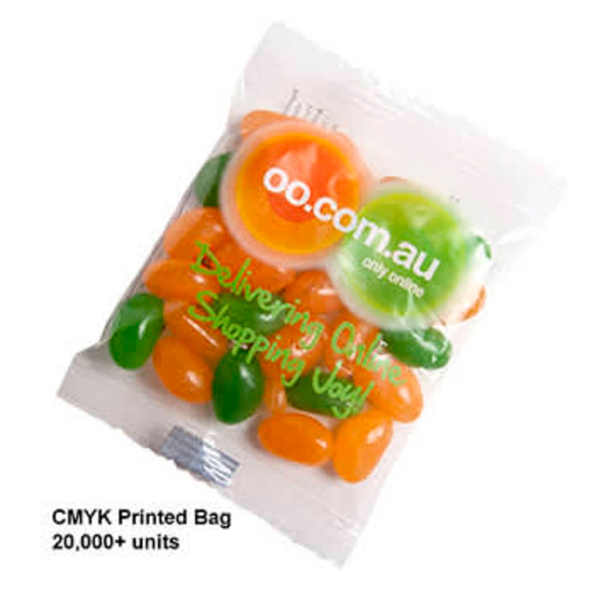 A bag of assorted jelly beans in green, orange, and yellow, with a logo on the packaging.