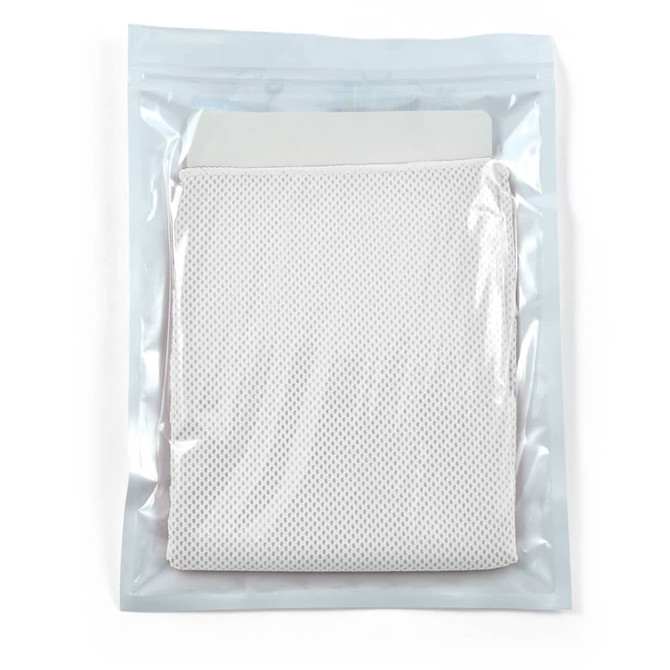 A cooling towel in a pouch, featuring a textured, breathable fabric, packaged in a clear plastic seal.
