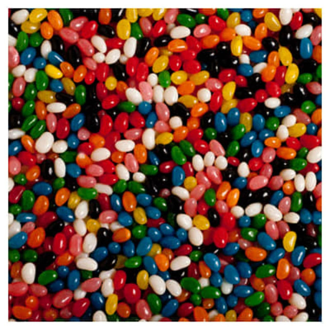 A variety of mini jelly beans in vibrant colours, including red, green, blue, black, orange, pink, and white, scattered together.