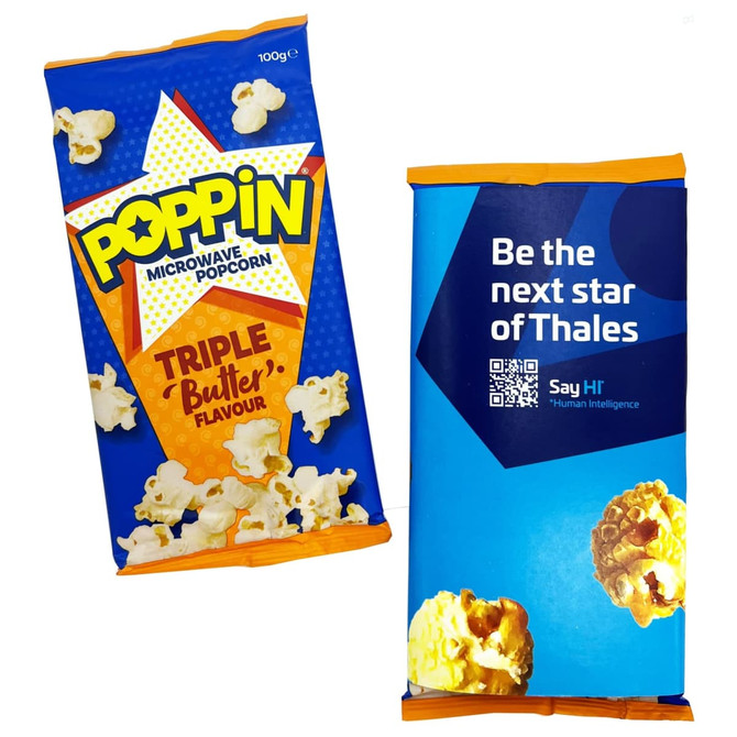 Two packets of microwave popcorn. One is brightly coloured blue and yellow with a butter flavour, while the other is blue with a logo.