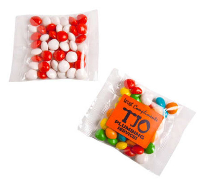 A packet of Chewy Fruits containing red, white, and multicoloured sweets, with a logo on the front.