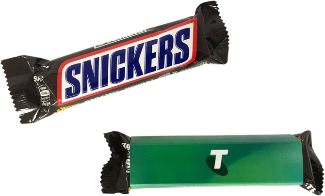 A Snickers chocolate bar wrapped in a black and blue wrapper, featuring a logo and an additional green sleeve.