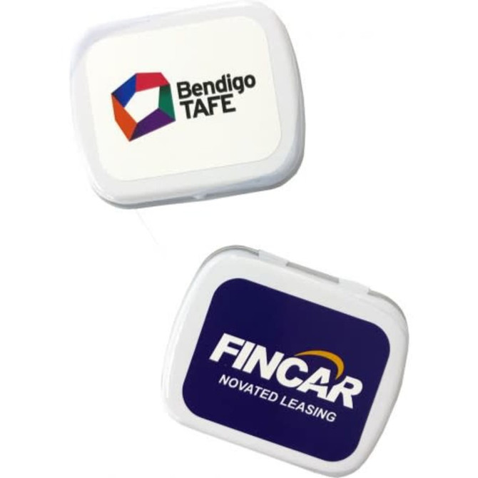 A small white rectangle tin with colourful logos, containing sugar-free lollies.