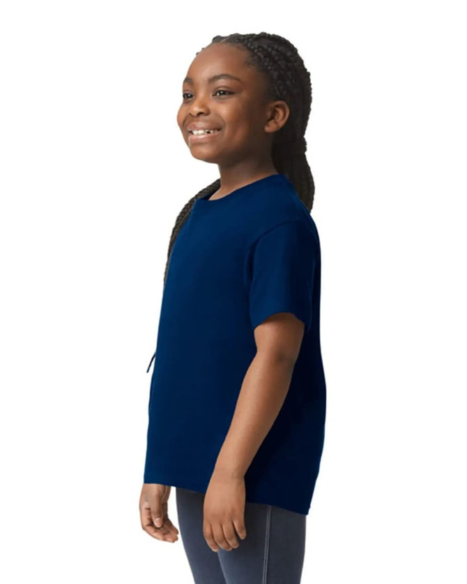 A youth short sleeve t-shirt in navy blue, featuring a simple design and a logo. The model is smiling while wearing it.