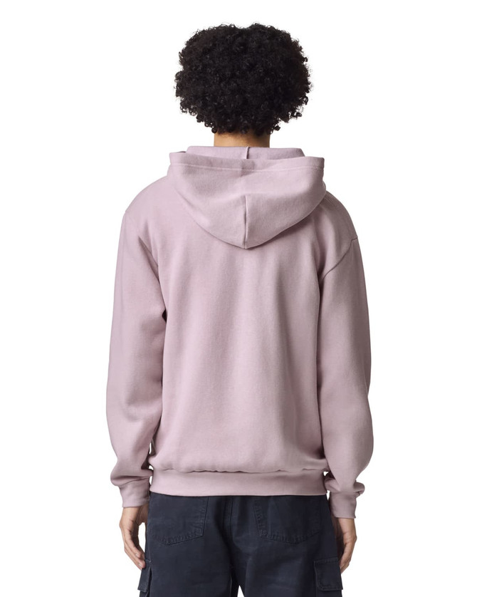 A unisex full zip hooded sweatshirt in a soft pink shade, showcasing a plain back view. It has a logo on the hood.