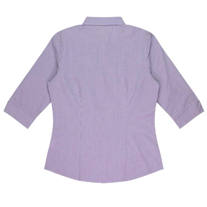 A button-up shirt with 3/4 sleeves in a purple check pattern, featuring a collar and a fitted design. It has a logo.