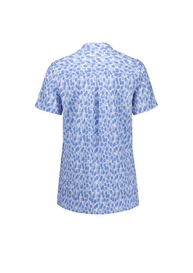 A short-sleeved tunic in a blue stardust print with a button-up collar and a logo on the back.