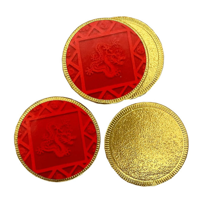 Red and gold chocolate medallions with intricate designs, featuring both red and gold finishes, arranged in a group.