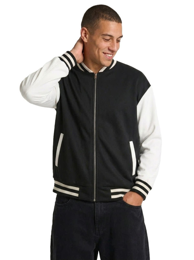 A men's/unisex wool blend varsity jacket featuring black and white colours, with striped cuffs and a zip front.