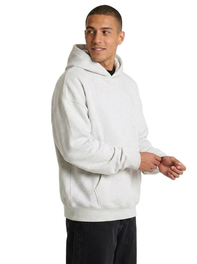 A grey oversize hoodie with a front pocket and a hood, featuring a logo on the chest.