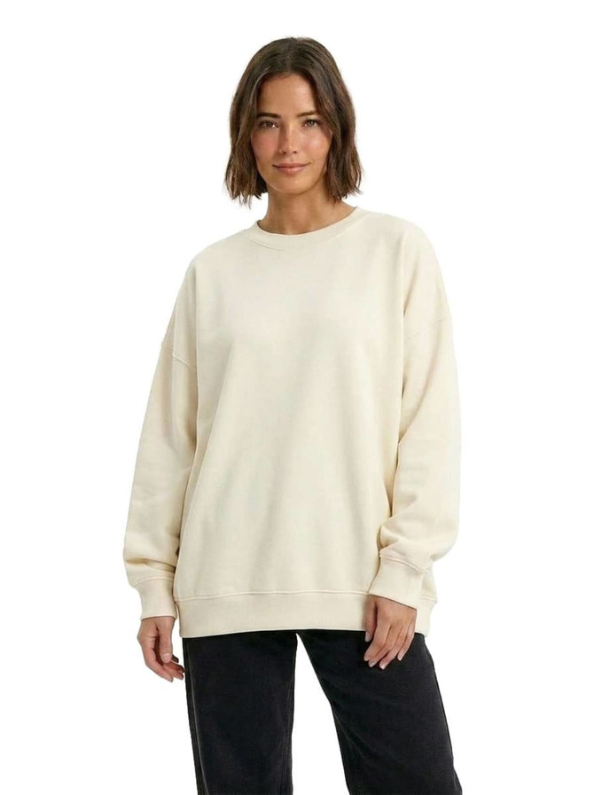 An adult's oversize crew neck fleece in a light beige colour, featuring long sleeves and a relaxed fit.