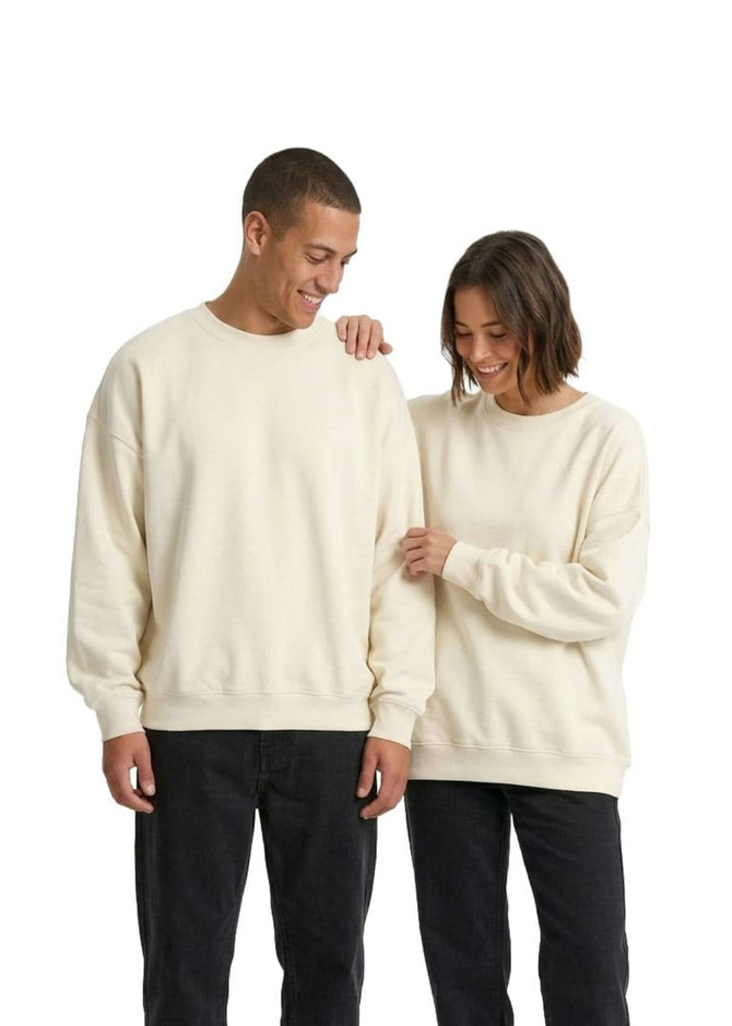 Two individuals wearing cream-coloured oversized crew neck fleece jumpers, with one featuring a logo.