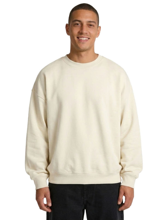 An oversize cream-coloured fleece jumper featuring a crew neck design and long sleeves.