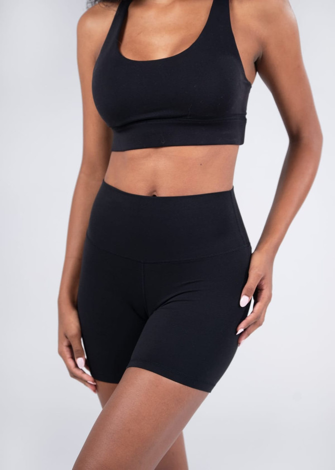 A pair of women's high rise legging shorts in black, featuring a sleek design and a fitted silhouette.