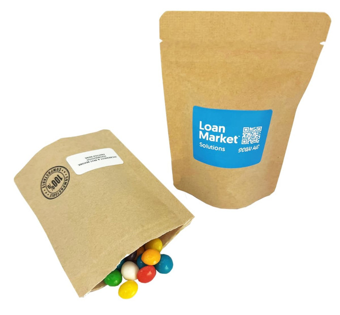 A brown compostable bag filled with colourful chewy fruit sweets, beside another similar bag with a logo.