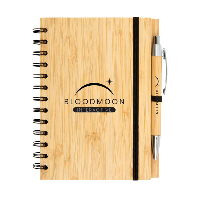 A bamboo notebook featuring a black spiral binding and an elastic band, accompanied by a matching pen.