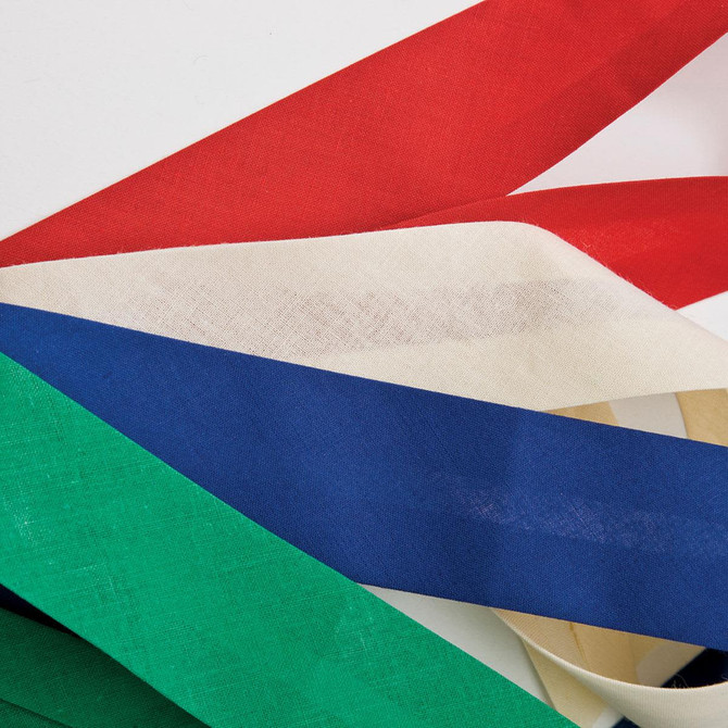 A collection of ribbon strips in red, white, blue, green, and cream laid out on a white background.