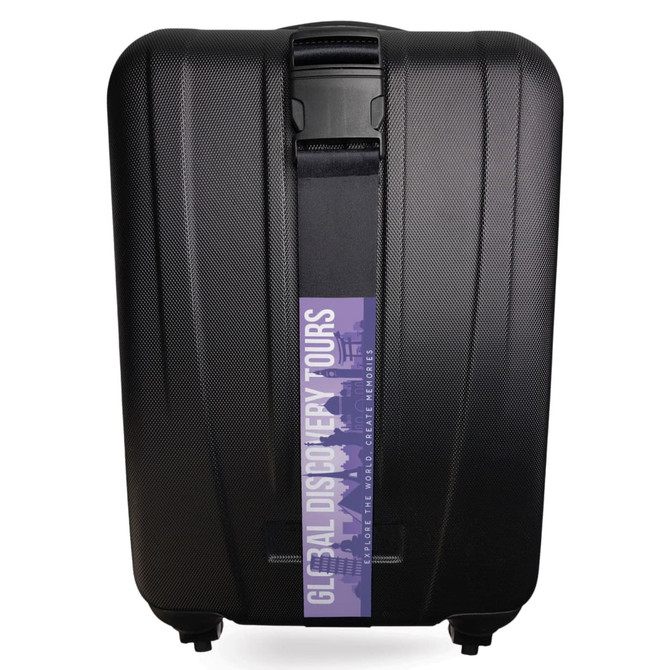 A black hard-shell suitcase with a luggage strap featuring a logo across the front.