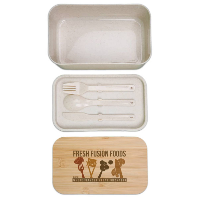 A beige lunch box with a bamboo lid, containing utensils including a fork and spoon. It features a logo.