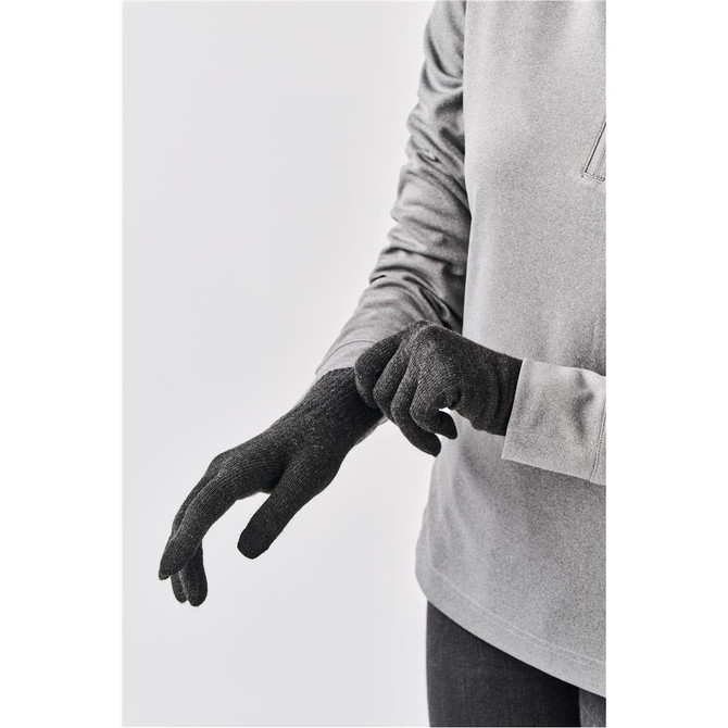 A pair of knit gloves in charcoal grey, displayed on a hand against a neutral background. The gloves have a logo.