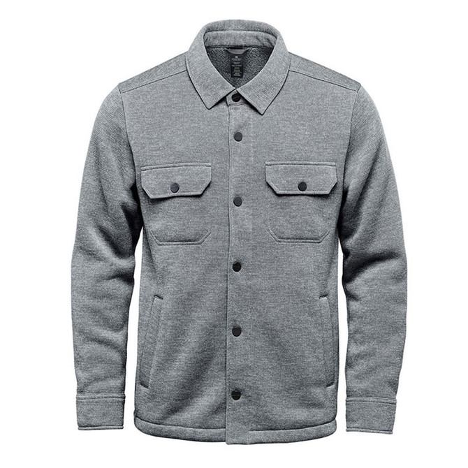 A grey unisex fleece shacket with two chest pockets and a button-up front. Features a logo on the design.