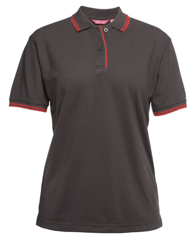A dark grey polo shirt with red contrast details on the collar and sleeves. It features a logo on the chest area.