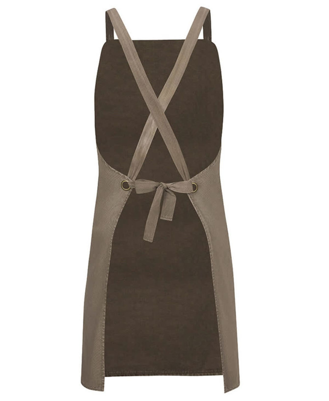 A cross back canvas apron in olive green with a contrasting beige trim and tied waist. Features a logo.