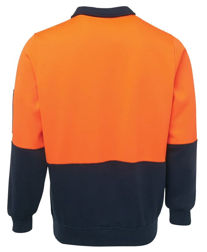 An orange and navy fleece top with long sleeves and a collar. Features a logo on one sleeve.