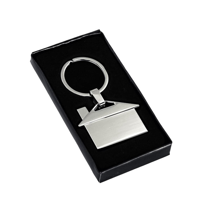 A silver house-shaped metal keyring in a black gift box. The keyring features a keyring loop for attachment.