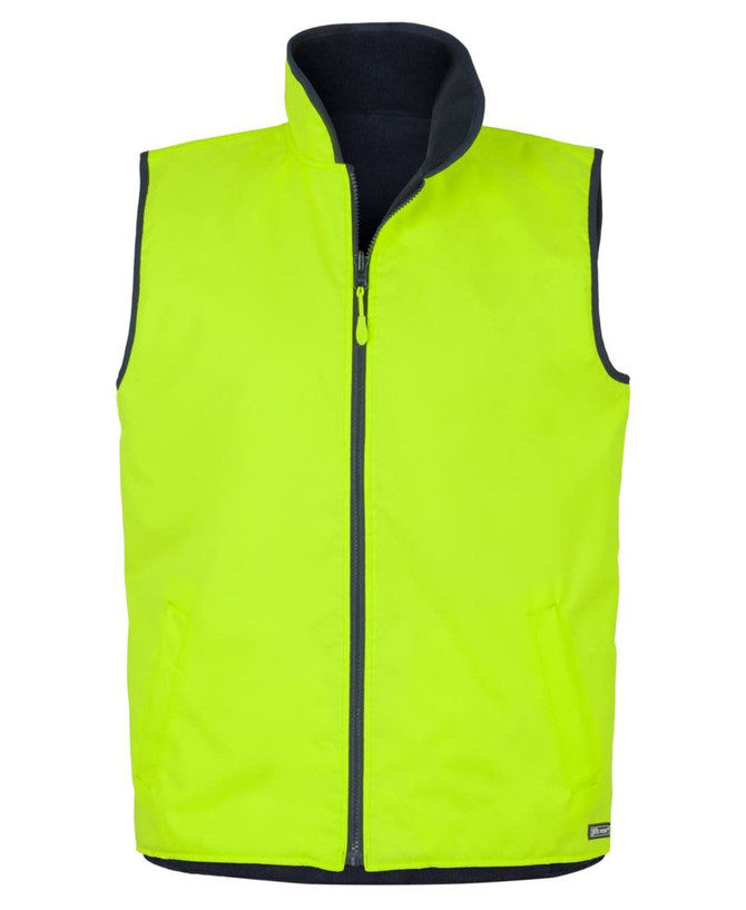 A high-visibility vest featuring a reversible design, in bright yellow with a navy interior. It has a front zip and pockets.
