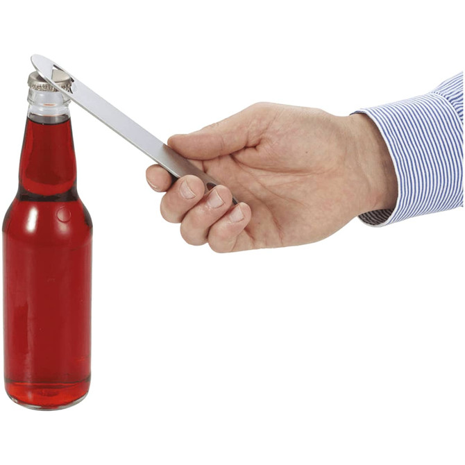A drink bottle with red liquid being opened by a hand using a silver bottle opener.