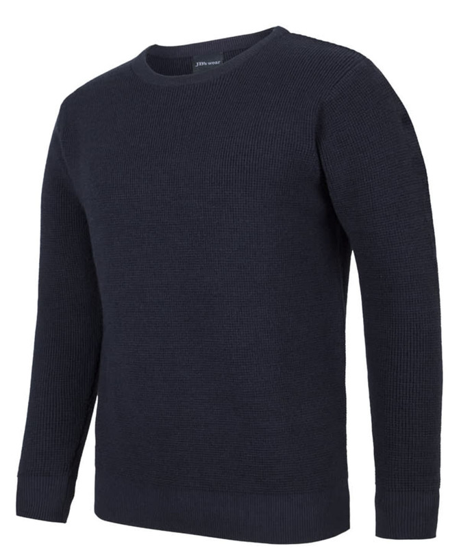 A chunky crew neck jumper in dark navy with a textured knit design. It has fitted cuffs and a simple silhouette.