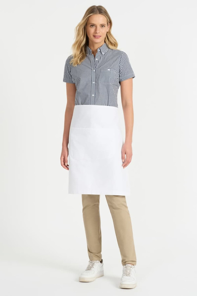 A ladies' short sleeve button-up shirt in a black and white check pattern, paired with a white apron and beige pants.