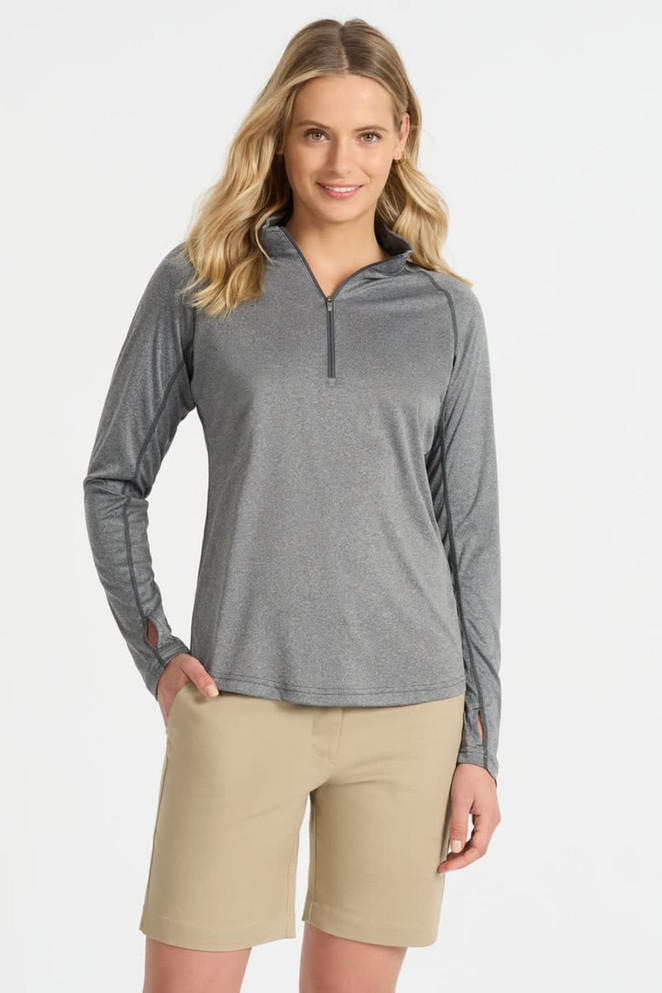 Grey long-sleeve zip-up top with a relaxed fit, paired with light beige shorts. The top features a logo on the front.