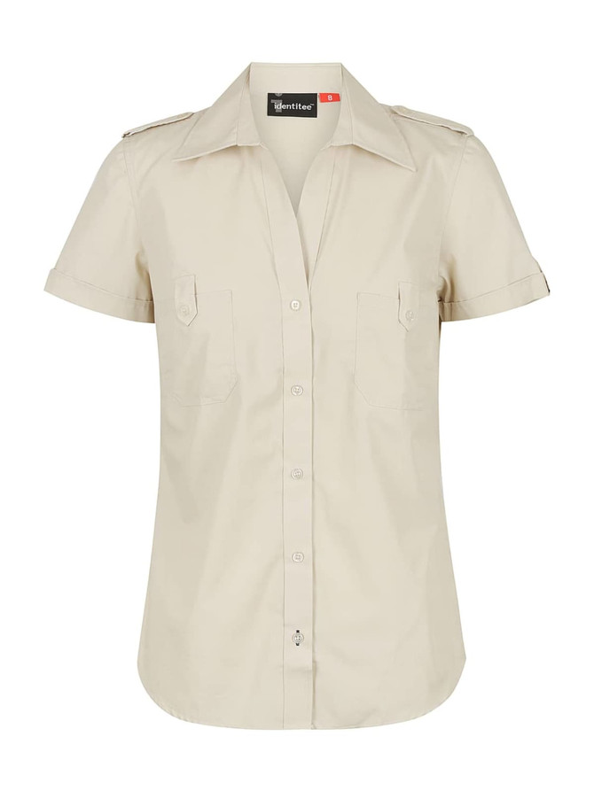 A beige ladies short sleeve button-up shirt with a collar and two chest pockets, featuring a logo on the label.